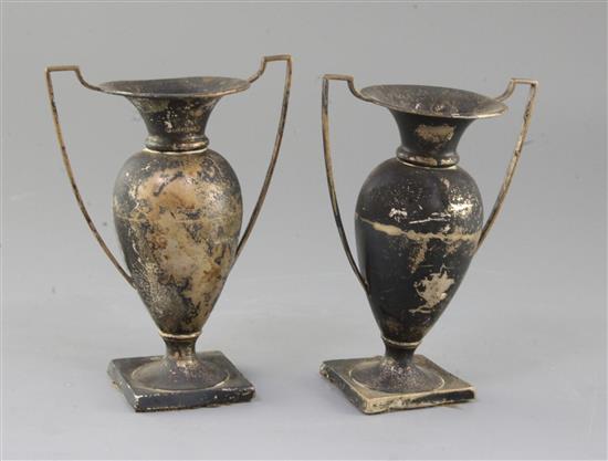 A pair of Edwardian silver two handled vases, A & J Zimmerman, Birmingham 1904, 13.5cm.